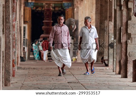 KUMBAKONAM, INDIA - JUL 14 : Unidentified devotees walk at the premises of  Kumbeshwarar temple on July 14, 2015 in Kumbakonam,India. The temple was built during the Chola dynasty in the 9th century.