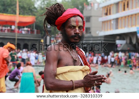 NASHIK - SEP 15:An unidentified Sadhu looks as he participates in the religious event Maha Kumbh Mela on September 15, 2015 in Nashik, India.Kumbhmela is a Hindu religious event gathered by millions.