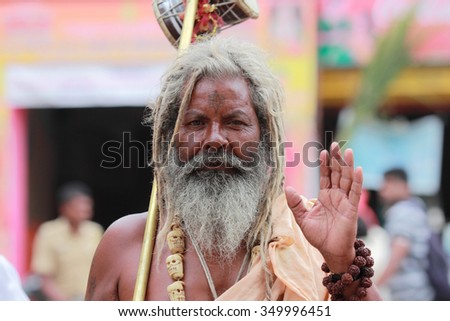 NASHIK - SEP 15:An unidentified Sadhu looks as he participates in the religious event Maha Kumbh Mela on September 15, 2015 in Nashik, India.Kumbhmela is a Hindu religious event gathered by millions