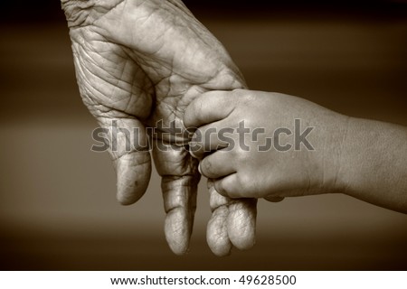Mencintai Kehidupan Dan Hidup Stock-photo-an-old-woman-and-a-kid-holding-hands-together-49628500