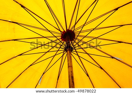Close up bottom view of a yellow beach umbrella