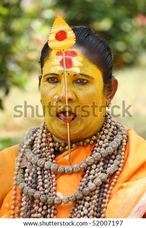 stock photo : THRISSUR, INDIA - APRIL 24 : A Female devotee tongue pierced 