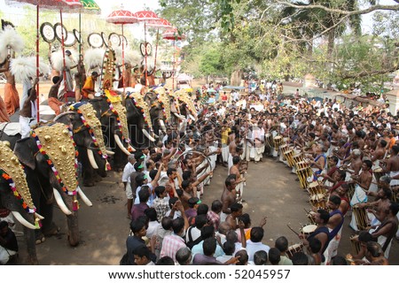 THRISSUR, INDIA - APRIL 24 : Gold caparisoned elephants and percussion in Pooram Festival April 24, 2010 in Thrissur, Kerala, India.