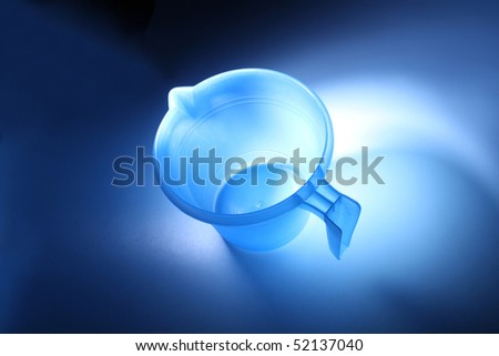 Top view of an empty transparent blue plastic mug