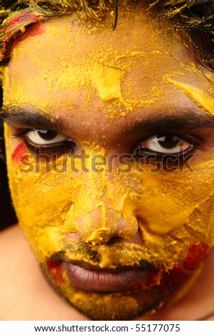 An yellow colored face looking straight