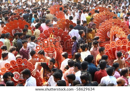 MAHE, INDIA - JANUARY 31 : Theyyam artists performing at the middle of the crowd at Palloor temple festival January 31, 2010 in Mahe, India.