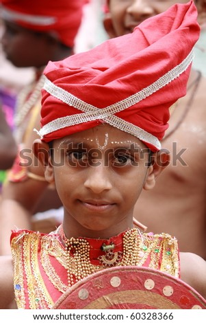 ARANMULA, INDIA - AUGUST 27 : An unidentified child, a Young Velakali performer in costumes during Aranmula Boat Race August 27, 2010 in Aranmula, India. Velakali is a ritual art from Kerala.