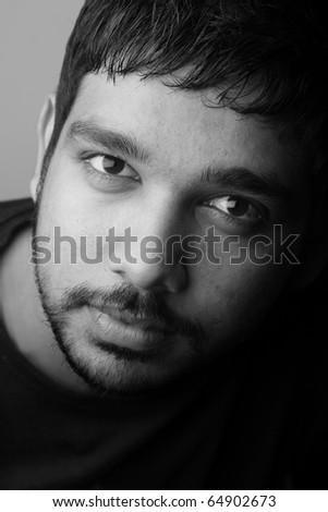 Close up black and white portrait of a romantic Indian male