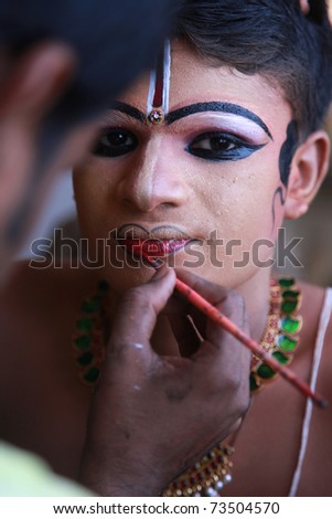 KOTTAYAM, INDIA - JANUARY 18:   Dance contestant doing makeup at Kerala school youth festival at Kottayam on January 18, 2011.The biggest festival of school children in Asia.
