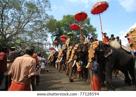 THRISSUR, INDIA - MAY 12 : Decorated elephants stand in line for procession at Elephant Festival on May 12, 201 in Thrissur, India. Thrissur Pooram is the most popular elephant festival in India.