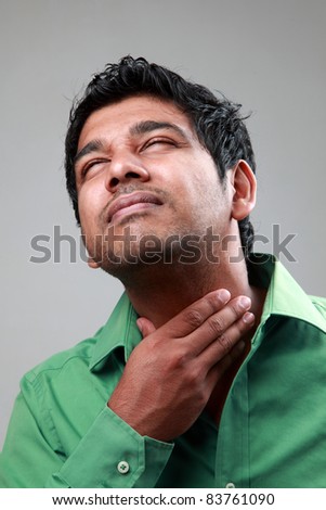 stock photo Young man suffers from throat infection