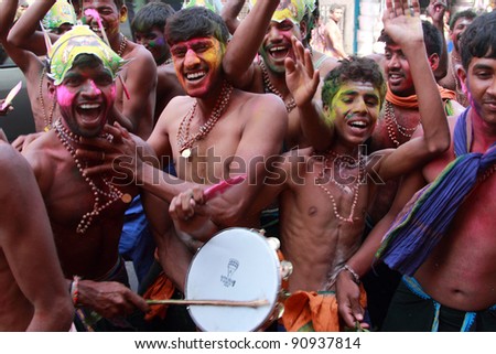 ERUMELI, INDIA - DEC 16 : Devotees of Lord Ayyappa sing and dance on the way to Sabarimala pilgrimage on December16, 2011 in Erumeli, India. Around 50 million visit Sabarimala every season