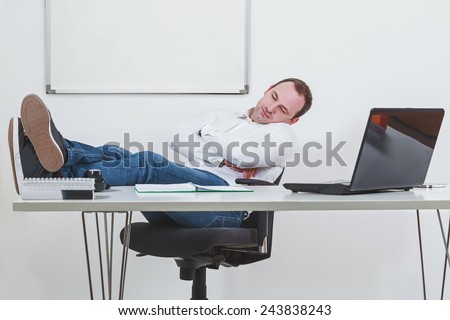 Businessman sleeping on the job at work