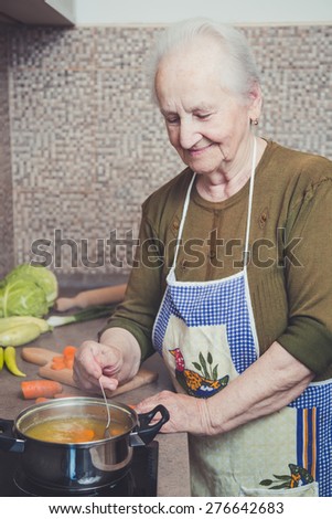 Grandmother cooking on a stove