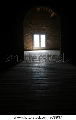 Bright light shining through the window of an attic, a beautiful reflection on the wooden floor.