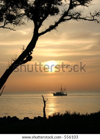 Sunrise over the Atlantic Ocean and a Shrimp Boat