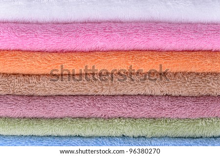 colorful bath towels stacked photographed at close range