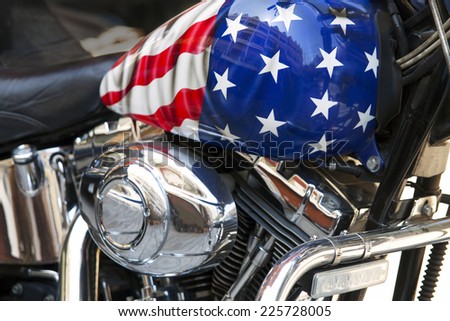 Motor and the fuel tank of a motorcycle with an American flag