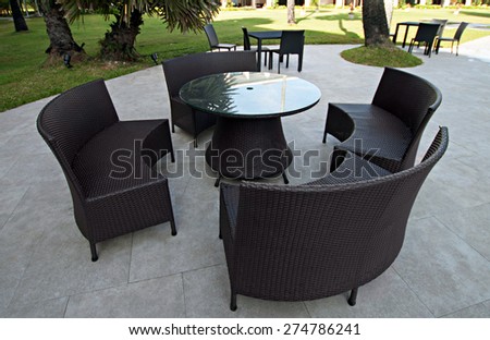 Open-air cafe furniture, wicker chairs and table