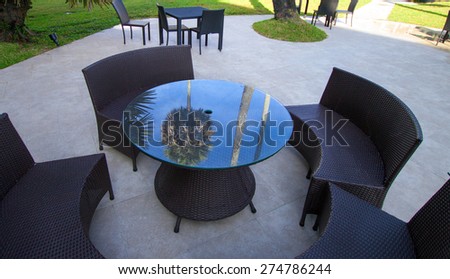 Open-air cafe furniture, wicker chairs and table