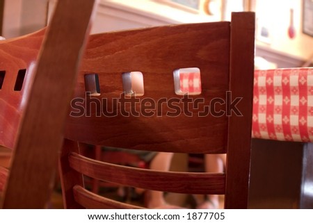 Close Up on Restaurant Chairs with Table Cloth