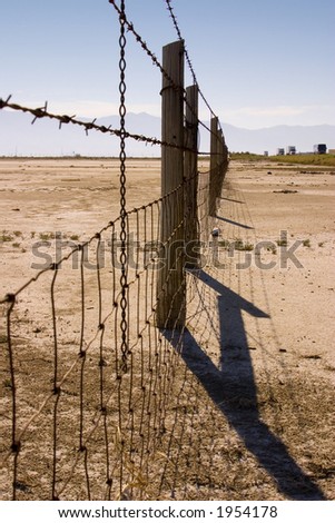 Fence in the Sale Lake in Summer in Utah with Clear Blue Skies