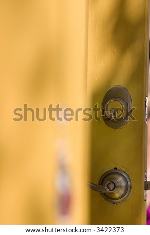 Wooden Yellow Orange Door with Paints Coming Out