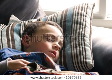 Little Boy Sleeping on the Couch