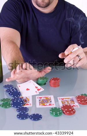 Man goes all in with royal flush pushing his chips for bet