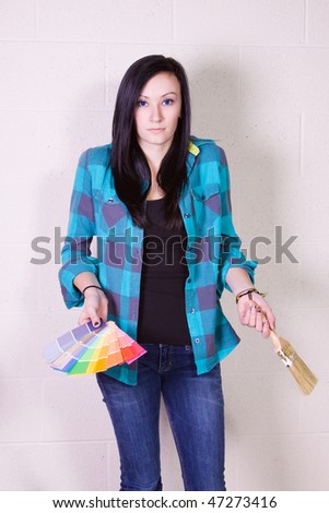 Beautiful Girl Having a Hard Time Choosing a Color For the Wall