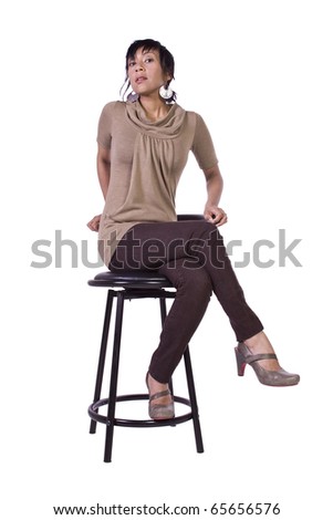 Beautiful Woman Posing on a Chair - Isolated White Background