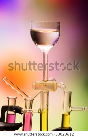 Photo of tubes and weighing bottles, made in close on a colored background