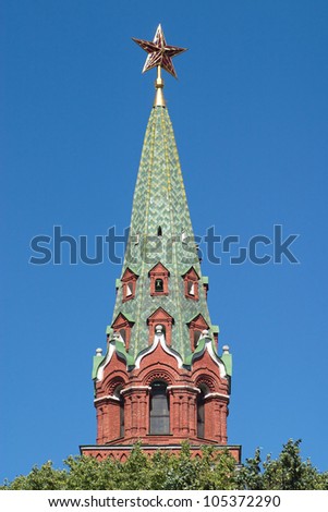 Moscow Kremlin Tower with red star closeup isolated on blue vertical