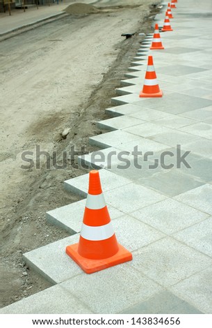 Construction of city pedestrian area gray stone tile