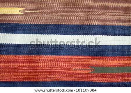 Woven fabric with color horizontal stripes as texture background closeup