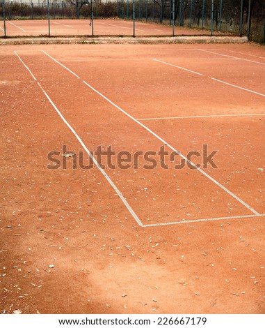 End of summer sport season. Empty tennis courts in autumn park