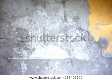 Wall in gray stucco inside house in process of repair as background closeup