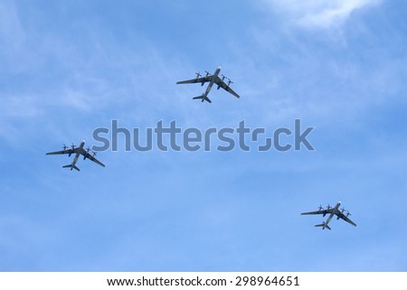 MOSCOW - MAY 9: Three Russian military turboprop strategic bombers-missile Tu-95 Bear in flight in blue sky on parade on May 9, 2015