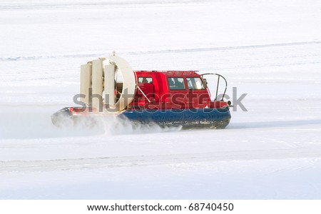 Rescue service snowmobile patrol on duty in winter on north
