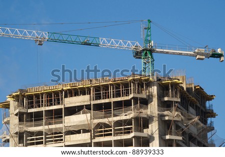 Hoisting tower crane and top of constructing building house