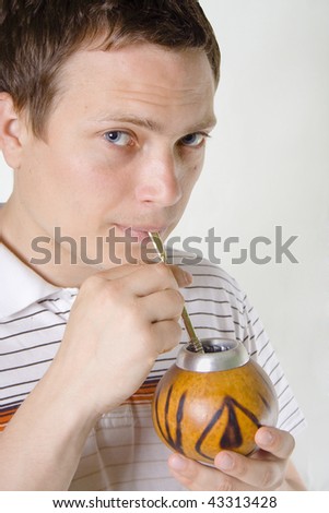 Portrait of a man drinking mate tea through bambilla