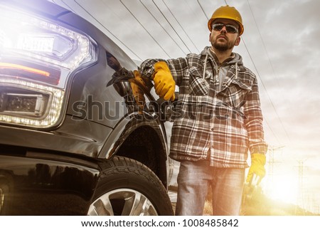 Caucasian Contractor in His 30s and His Modern Heavy Duty Pickup Truck For Heavy Loads.