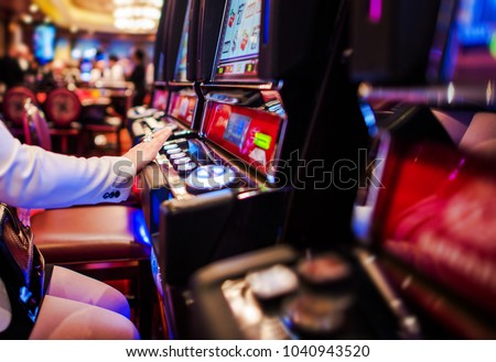 Woman Feeling Lucky Playing Casino Slot Machines. Gambling Theme.