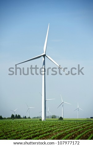Wind Energy Technology. Wind Turbines in USA. Vertical Photography.