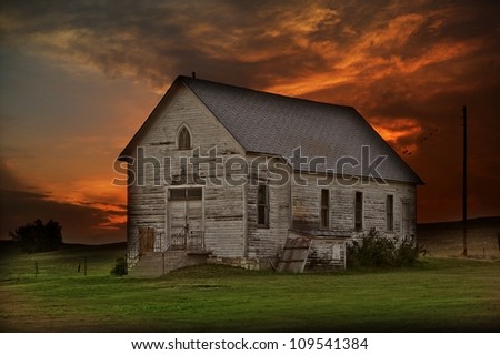 Rustic Prairie Building - Somewhere in Western South Dakota State, USA. Old Wood City Building in the Center of Nowhere. Sunset Sky in a Background. HDR-Like Composition.
