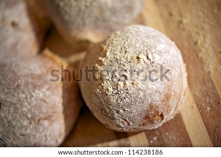 Home-Made Fresh Rye Rolls on Wood Board. Fresh Bakery Photo Collection.
