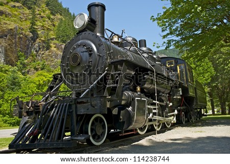 Old Western Steam Locomotive - Historical Railroad Locomotive Exposition. Washington State, USA. Transportation Photo Collection.