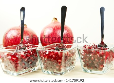 Pomegranate Desserts in Glass on White Background. Raw Healthy Pomegranate Seeds. Organic Food Photo Collection.