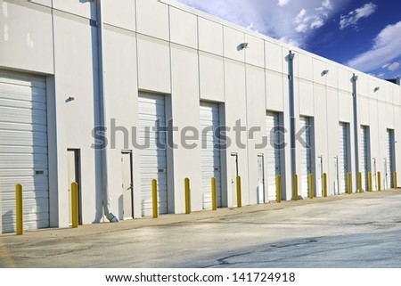 Warehouse Gates. Shipping, Storage and Cargo Industry Photo Collection. Large Warehouse Building. All Gates Closed.