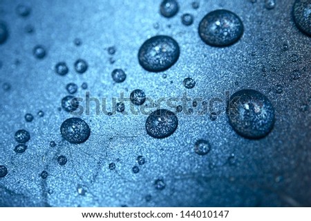 Water Drops Blue Background. Water Drops on Metallic Surface.